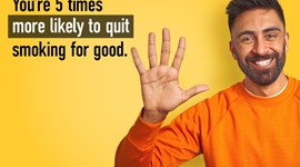 A man in an orange jumper holding up five fingers, with the quote 'You're five times more likely to quit smoking for good'.